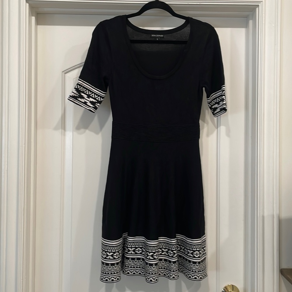 Nina Leonard Black dress, no sleeves, tulle skirt and loose neck.